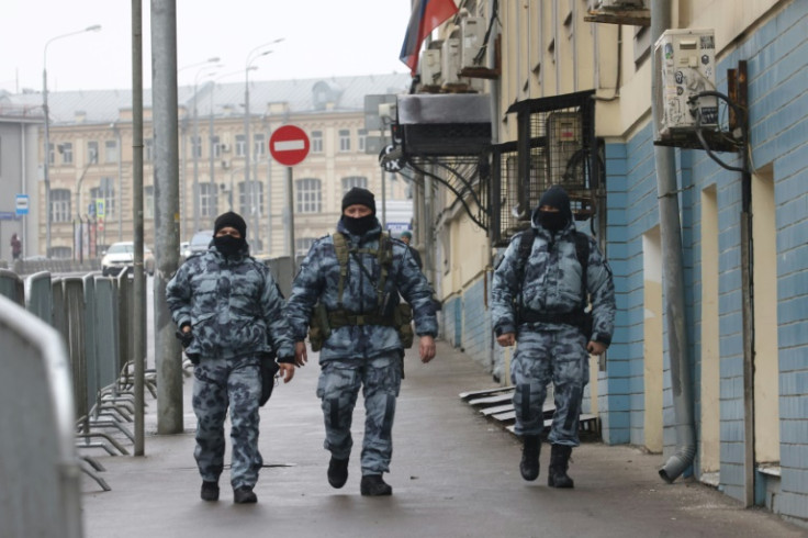 Law enforcement officers secure an area outside a Moscow district court as Russia observed a national day of mourning after the concert hall massacre