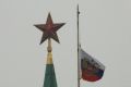 The Standard of the President of the Russian Federation flutters at half-mast on top of the Senate Palace dome at the Kremlin