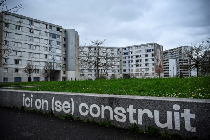The Francs-Moisins estate near the Stade de France where a sign says 'Here we build (ourselves)'