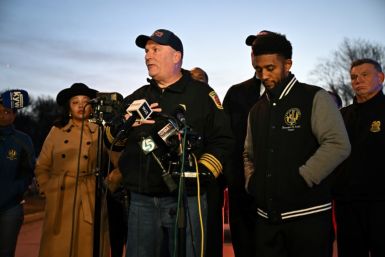 Baltimore Fire Department Chief James Wallace, with Police Commissioner Richard Worley (R) and Mayor Brandon Scott (2nd R), speaks at a press conference on the collapse of the Francis Scott Key Bridge