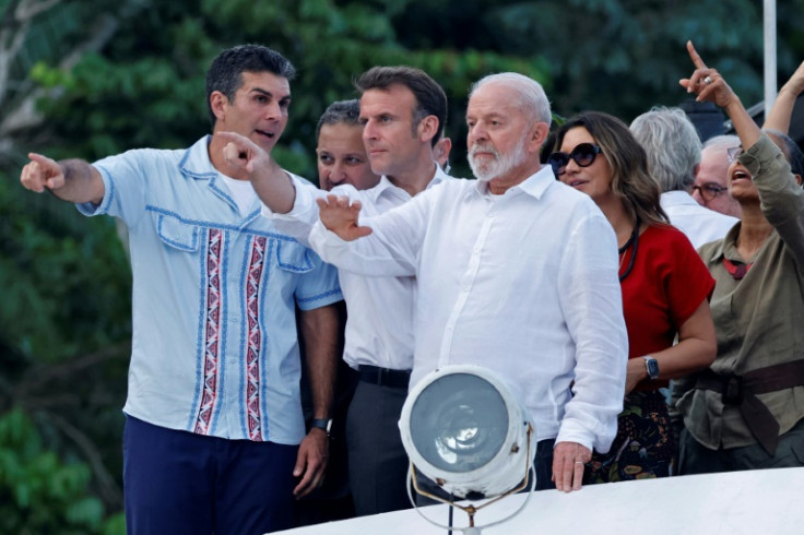 (L to R) Para state Governor Helder Barbalho, French President Emmanuel Macron, Brazilian President Luiz Inacio Lula Da Silva, his wife Rosangela Da Silva, and Brazil's Minister of the Environment Marina Silva sail on boat to Combu Island in Brazil on Mar