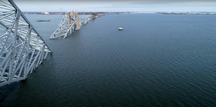 From the banks of the Patapsco River, bits of the steel bridge could be seen protruding from the water