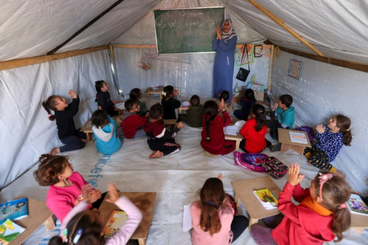 Children in a makeshift classroom at a camp for displaced Palestinians in Rafah, in the southern Gaza Strip, on March 26, 2024