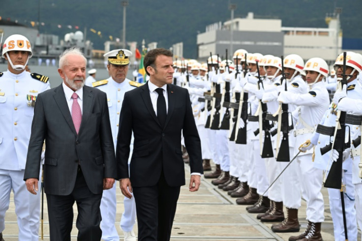 Brazilian President Luiz Inacio Lula da Silva (L) and French President Emmanuel Macron arrive for the launching of the Tonelero submarine at the Itaguai naval base
