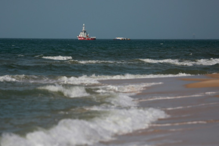 The Open Arms charity vessel and a barge carrying humanitarian aid for the Gaza Strip are pictured off Gaza City on April 1, 2024