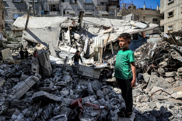 A boy amid the rubble of a collapsed building in Rafah in the southern Gaza Strip on April 9, 2024
