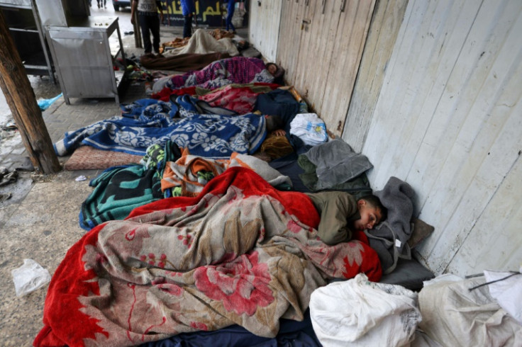 Displaced Palestinians sleep outside in Rafah, southern Gaza Strip, on April 10, 2024