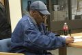 This image released by the Nevada Department of Corrections shows O.J. Simpson signing documents and leaving prison in Nevada in October 2017