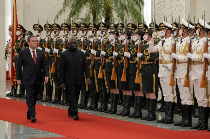 Solomon Islands has veered into China's orbit under Prime Minister Manasseh Sogavare (R)