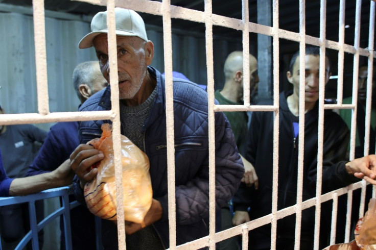 Palestinians line up to buy subsidised bread at a bakery in Gaza City, where hunger spreads after more than six months of war