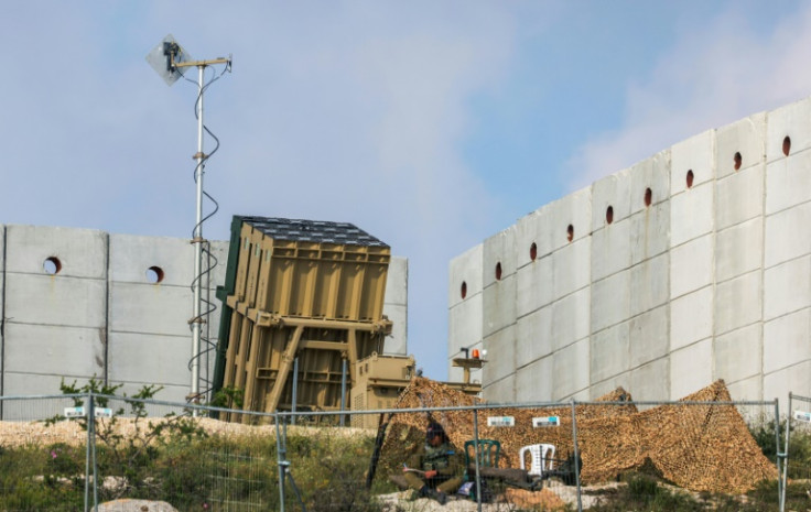 An Israeli soldier takes up a position in front of an air defence battery near Jerusalem