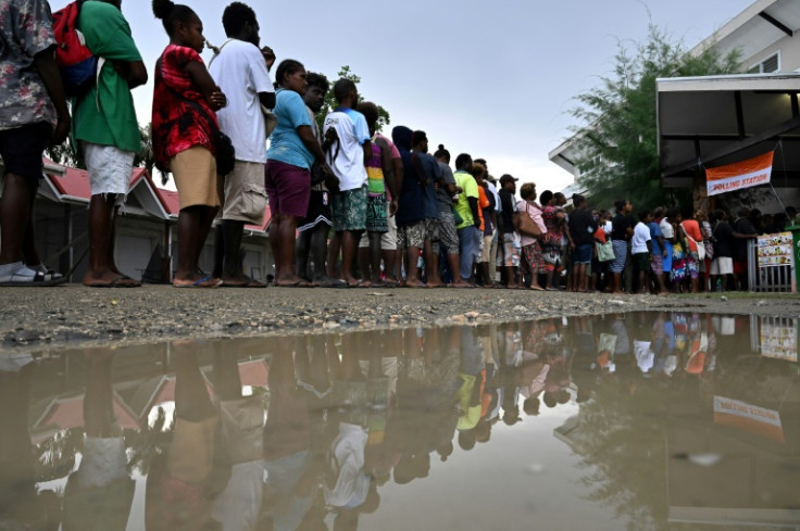 Solomon Islanders queue up to vote outside a polling station in Honiara on Wednesday