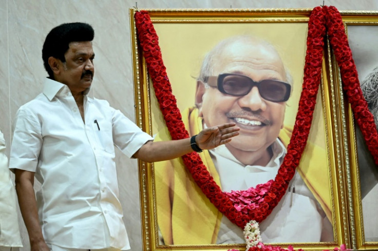 Dravida Munnetra Kazhagam (DMK) party president M.K. Stalin, standing beside a portrait of his father M. Karunanidhi