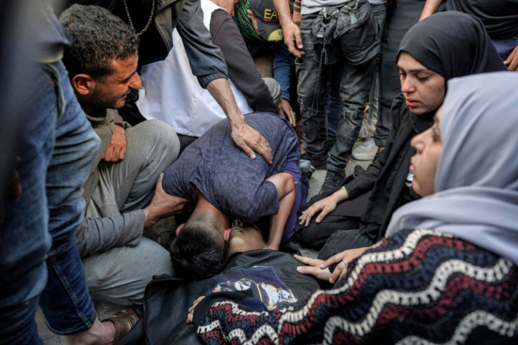 Palestinians mourn a victim of Israeli bombardment in Maghazi, in the central Gaza Strip, on April 16, 2024