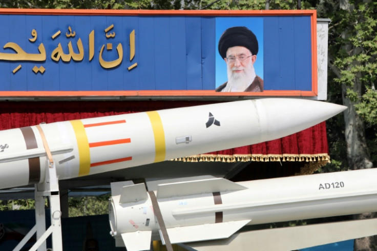 An Iranian military truck carries a Sayad 4-B missile past a portrait of supreme leader Ayatollah Ali Khamenei during a military parade on April 17, 2024