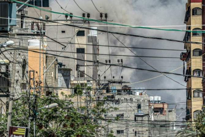 A cloud of smoke from an explosion in the central Gaza Strip on April 17, 2024