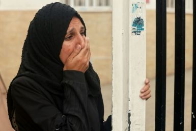A Palestinian woman mourns the death of a loved one at Al-Najjar hospital following overnight Israeli bombardment in Rafah in the southern Gaza Strip on April 18, 2024
