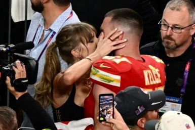 Taylor Swift kisses Kansas City Chiefs tight end Travis Kelce after the Chiefs won Super Bowl LVIII against the San Francisco 49ers