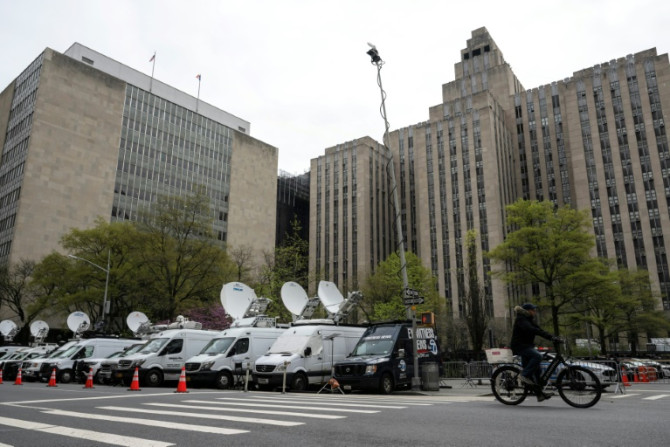 Media vehicles outside of the Manhattan Criminal Court building as former US President Donald Trump attends his trial