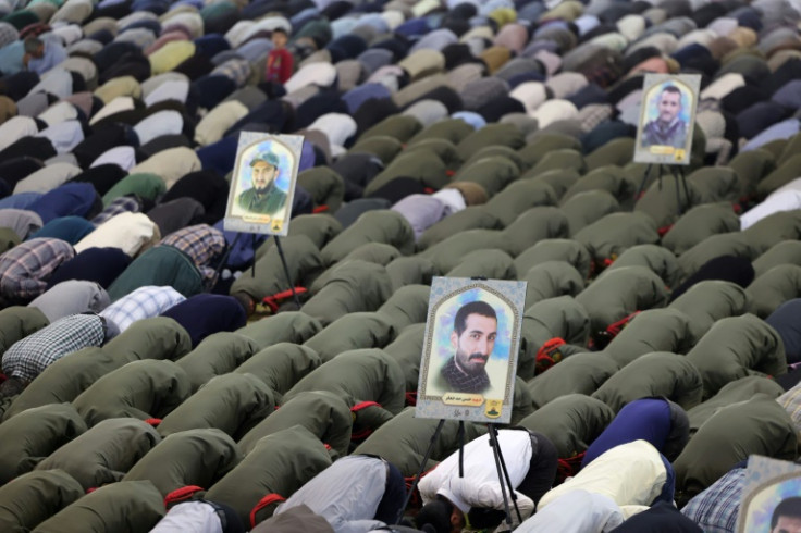 Iranians attend Friday noon prayer in Tehran, after explosions in the central region of the country