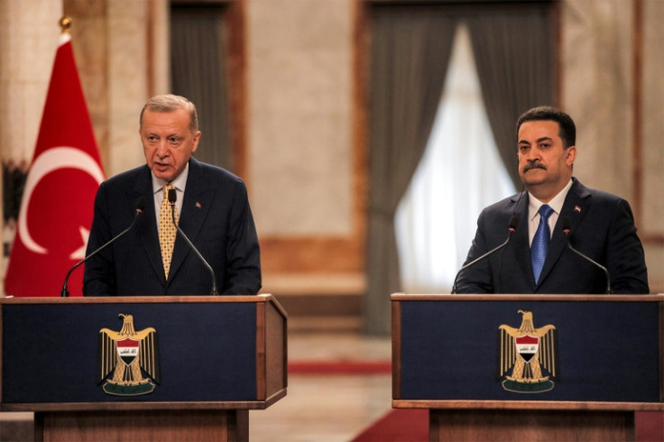Iraq's Prime Minister Mohammed Shia al-Sudani (R) and Turkey's President Recep Tayyip Erdogan speak to reporters in Baghdad