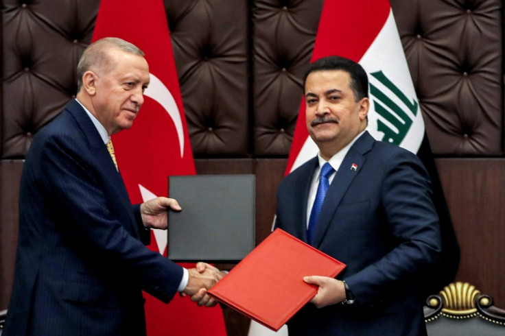 Turkey's President Recep Tayyip Erdogan and Iraq's Prime Minister Mohammed Shia al-Sudani exchange signed agreements