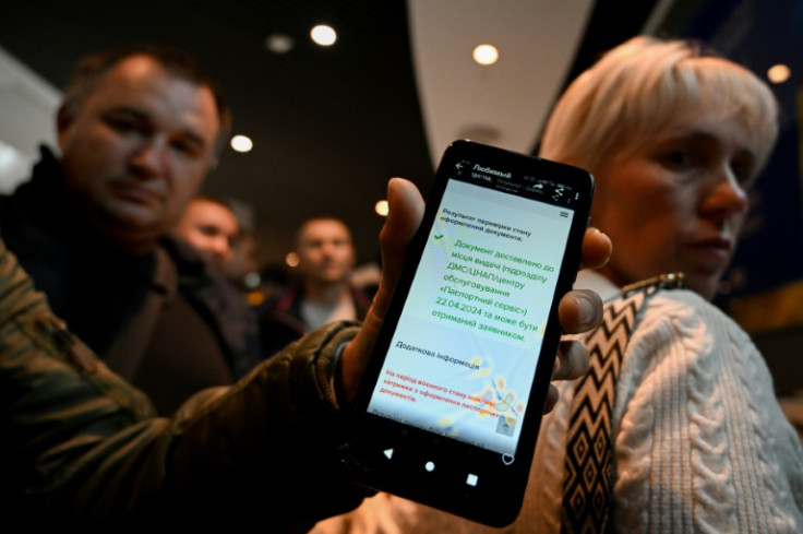 Ukrainians said they had received messages their passports were ready, but were blocked from entering the Warsaw office