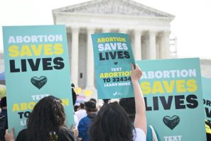 Pro-abortion activists rally for "reproductive rights and emergency abortion care" outside the US Supreme Court
