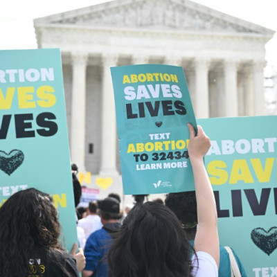 Pro-abortion activists rally for "reproductive rights and emergency abortion care" outside the US Supreme Court