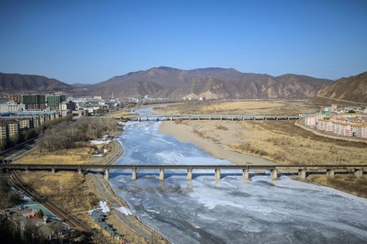 The Tumen river serves as the border between the Chinese city of Tumen (L) and the North Korean city of Namyang
