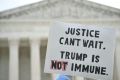 A sign held by anti-Trump protester outside the US Supreme Court