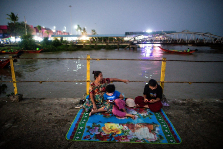 People gather at a jetty in Yangon in Myanmar, which has experienced higher-than-average April temperatures