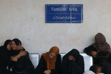 Palestinians at the al-Najjar hospital in Rafah mourn relatives killed in Israeli bombardment