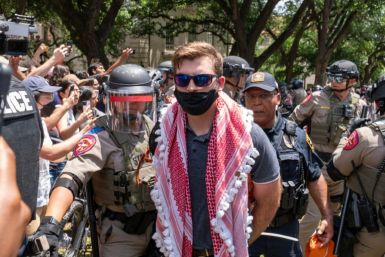 A pro-Palestinian protestor is arrested by Texas State Troopers at the University of Texas in Austin