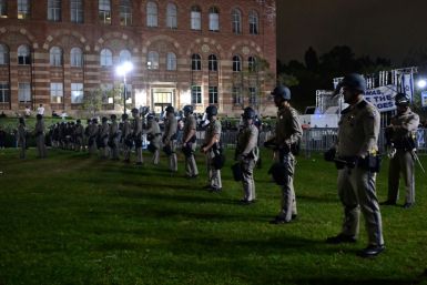 US police officers stand guard after clashes erupted on the campus of the University of California Los Angeles (UCLA)