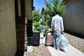 A man and his family gather their belongings after being evicted from a residential property