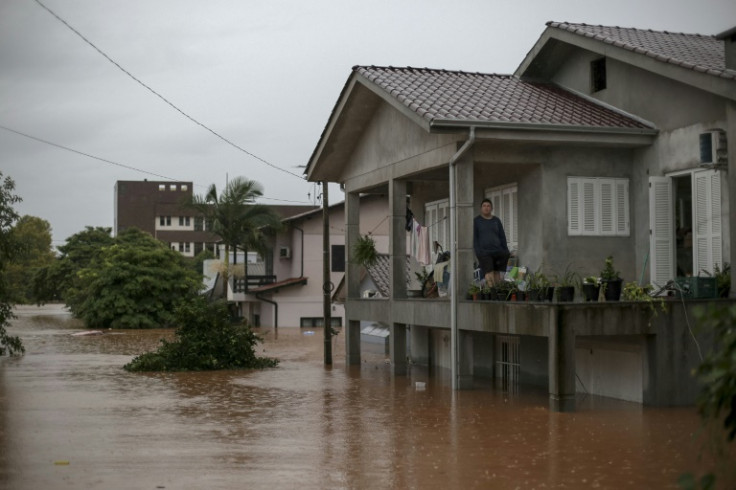 Rescuers and soldiers have been scrambling to free families trapped in their homes, many stuck on rooftops to escape rising waters