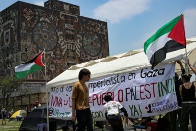 Activists erect a tent in front of the rectory building of the Autonomous University of Mexico (UNAM) as part of a camp to protest Israel's attacks on the Gaza Strip in Mexico City on May 2, 2024