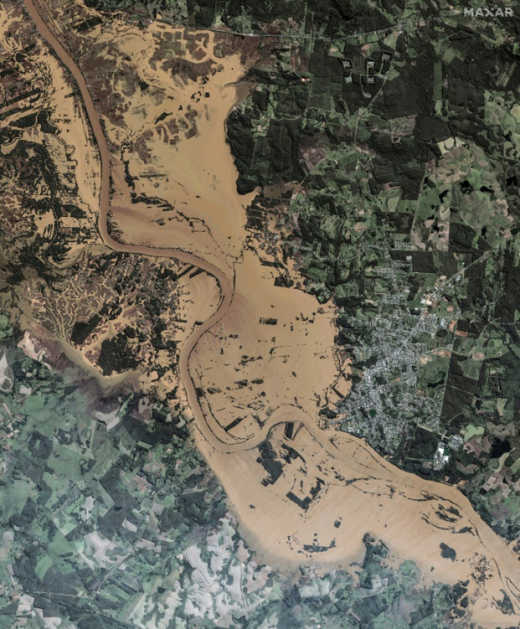 This handout satellite image courtesy of Maxar Technologies taken on May 7, 2024 shows the flooding along the Taquari river in the Brazilian state of Rio Grande do Sul, following torrential rains that have left at least 95 people dead