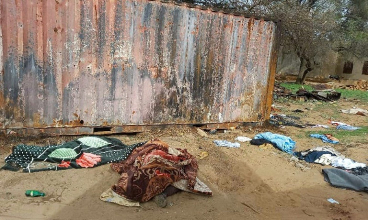 Bodies lie near houses last year in El-Geneina, where members of the Massalit community were targeted by Sudanese paramilitaries and their allies