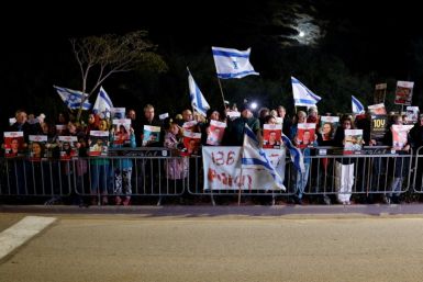 Protesters seeking a deal to free Israeli hostages protest outside Prime Minister Benjamin Netanyahu's private residence in Caesarea north of Tel Aviv on January 27, 2024