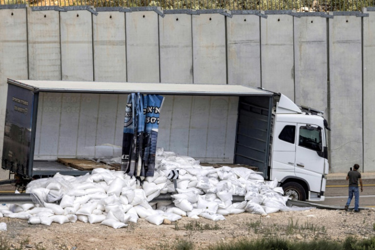 A truck with scattered aid supplies for Gaza after it was vandalised by right-wing Israeli activists near the West Bank village of Shekef