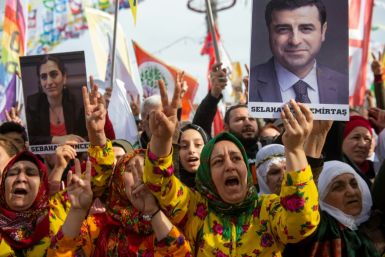 HDP supporters hold a picture of jailed ex-party leader Selahattin Demirtas at a rally in Istanbul in 2019