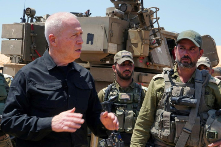 Gallant stands with soldiers during a visit to a position along the border with the Gaza Strip