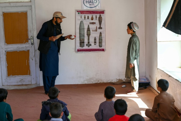 An Afghan teacher from the Halo Trust educates children about the risks of unexploded ordnance