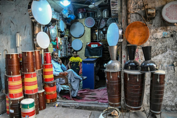 Shops selling shoes and musical instruments have have replaced the once-grand brothels