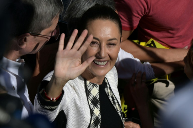 Mexican ruling party presidential candidate Claudia Sheinbaum waves as she arrives at a polling station in Mexico City