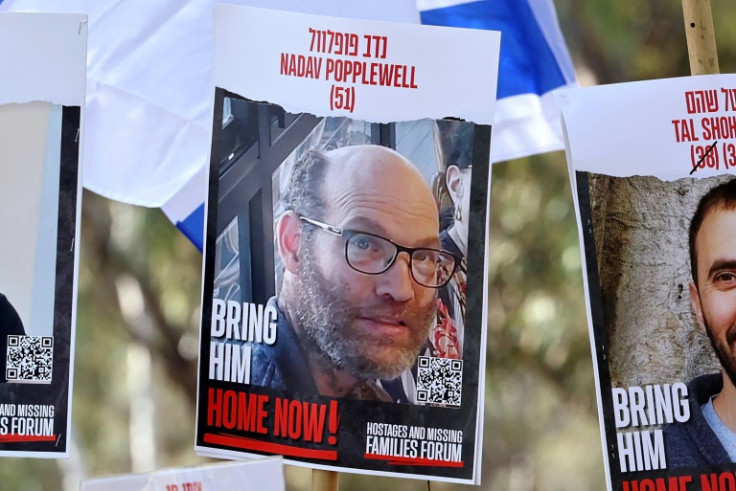A poster with the portrait of Nadav Popplewell at an Israeli rally calling for the release of hostages, in February