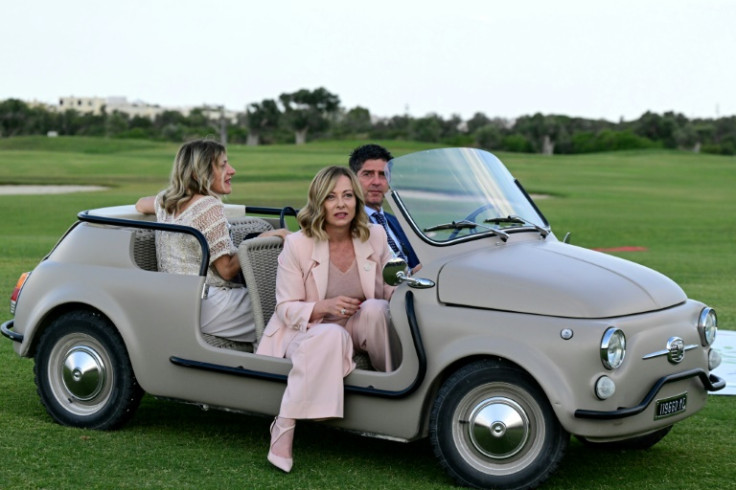 Italy's Prime Minister Giorgia Meloni (C) arrives at a a flag ceremony at Borgo Egnazia Golf Club San Domenico during the G7 Summit