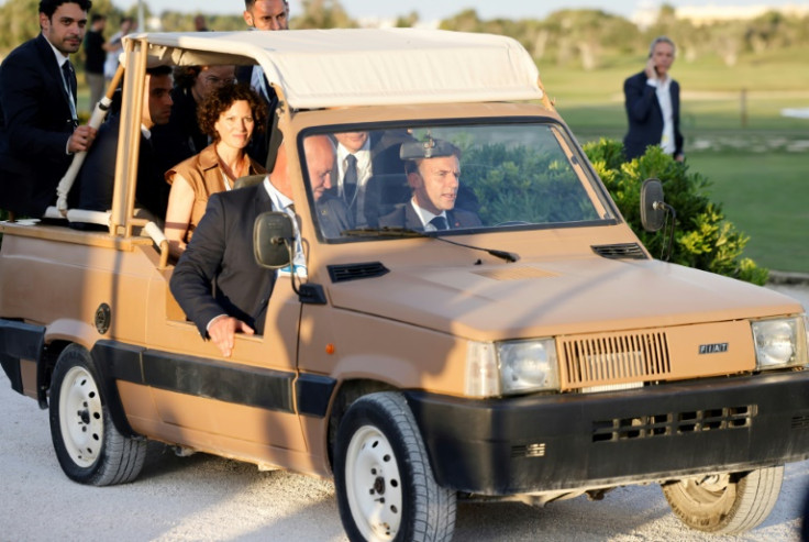 French President Emmanuel Macron drives an electric car during the G7 summit in Fasano, southern Italy